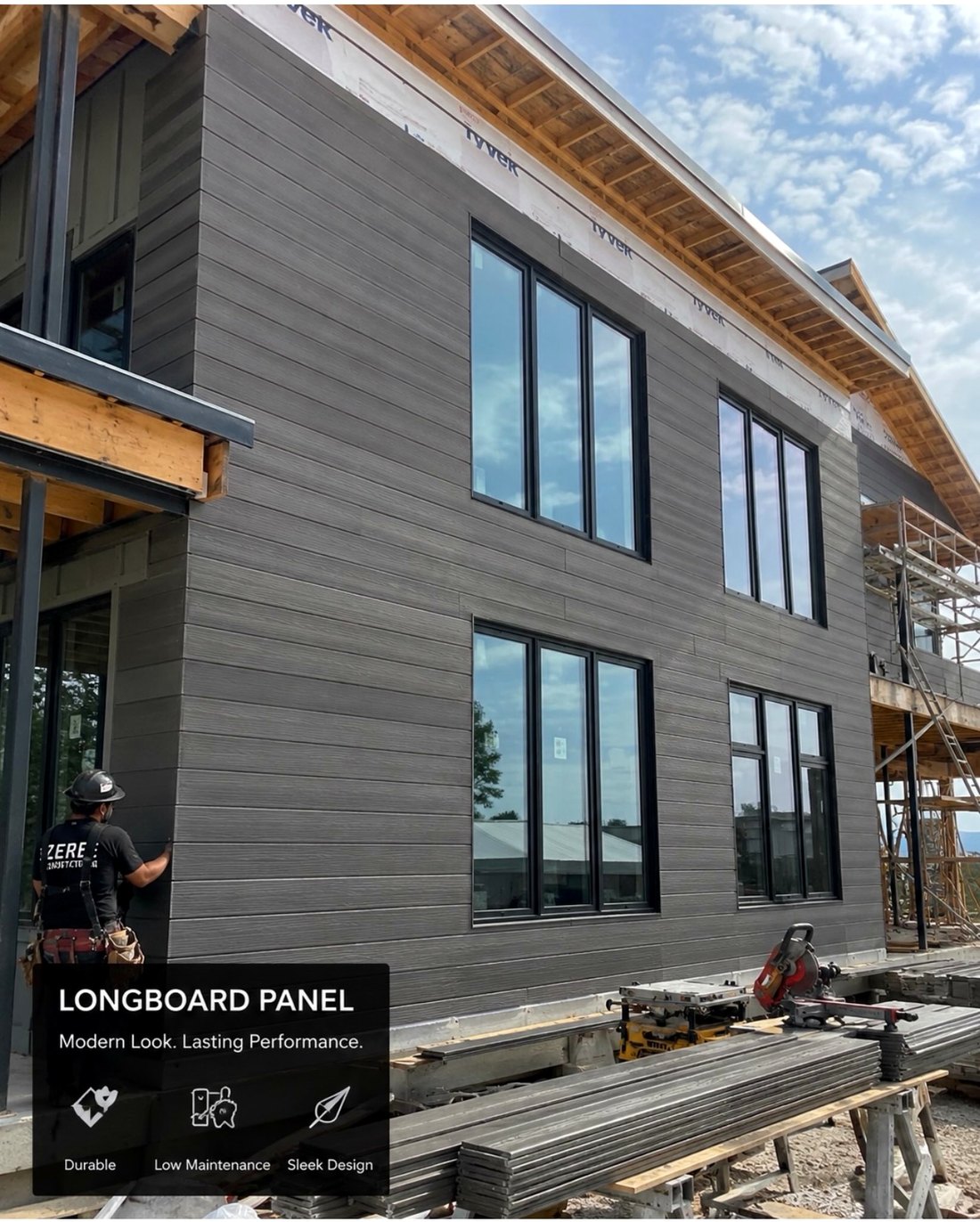 Zeren Construction installer fitting Longboard wood-look siding on a modern exterior