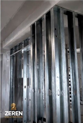 Close view of metal stud framing and track
